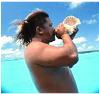 Blowing a conch shell