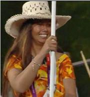 Helema carries the Cook Islands flag into the Olympics stadium