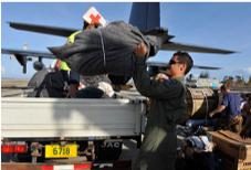 Unloading Red Cross blankets